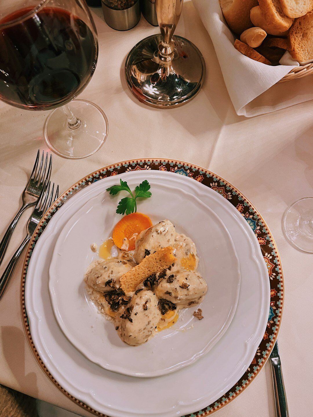 Traditional Czech svíčková with bread dumplings on a wooden table